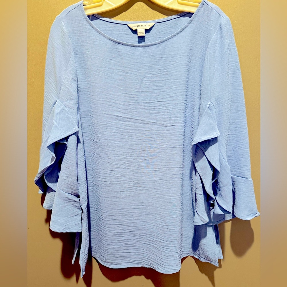 Counterparts blouse size Small. Color is light blue.